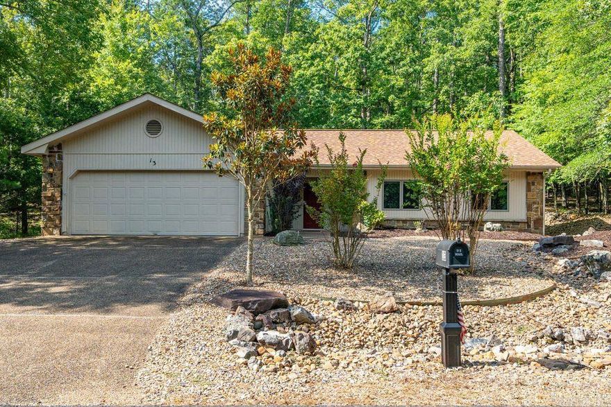 Welcome to 13 Campeon Lane – a beautifully maintained retreat nestled in the heart of Hot Springs Village! Step inside to an open-concept living area filled with natural light and vaulted ceilings. The kitchen features modern appliances, plenty of Granite counter space, and a breakfast bar that flows into the dining and living areas—perfect for entertaining or relaxing.  Enjoy peaceful mornings or tranquil evenings in the Arkansas Room overlooking the natural landscape. The spacious primary suite includes a walk-in closet and ensuite bath with double vanities and walk-in shower. Two additional bedrooms offer flexibility for guests, office space, or hobbies. Roof Replaced 2024. HVAC in attic updated. Updated Windows. New LVP Flooring and Tile.   Located in a quiet cul-de-sac, this home is just minutes from golf courses, lakes, and miles of scenic trails. Furniture is negotiable!