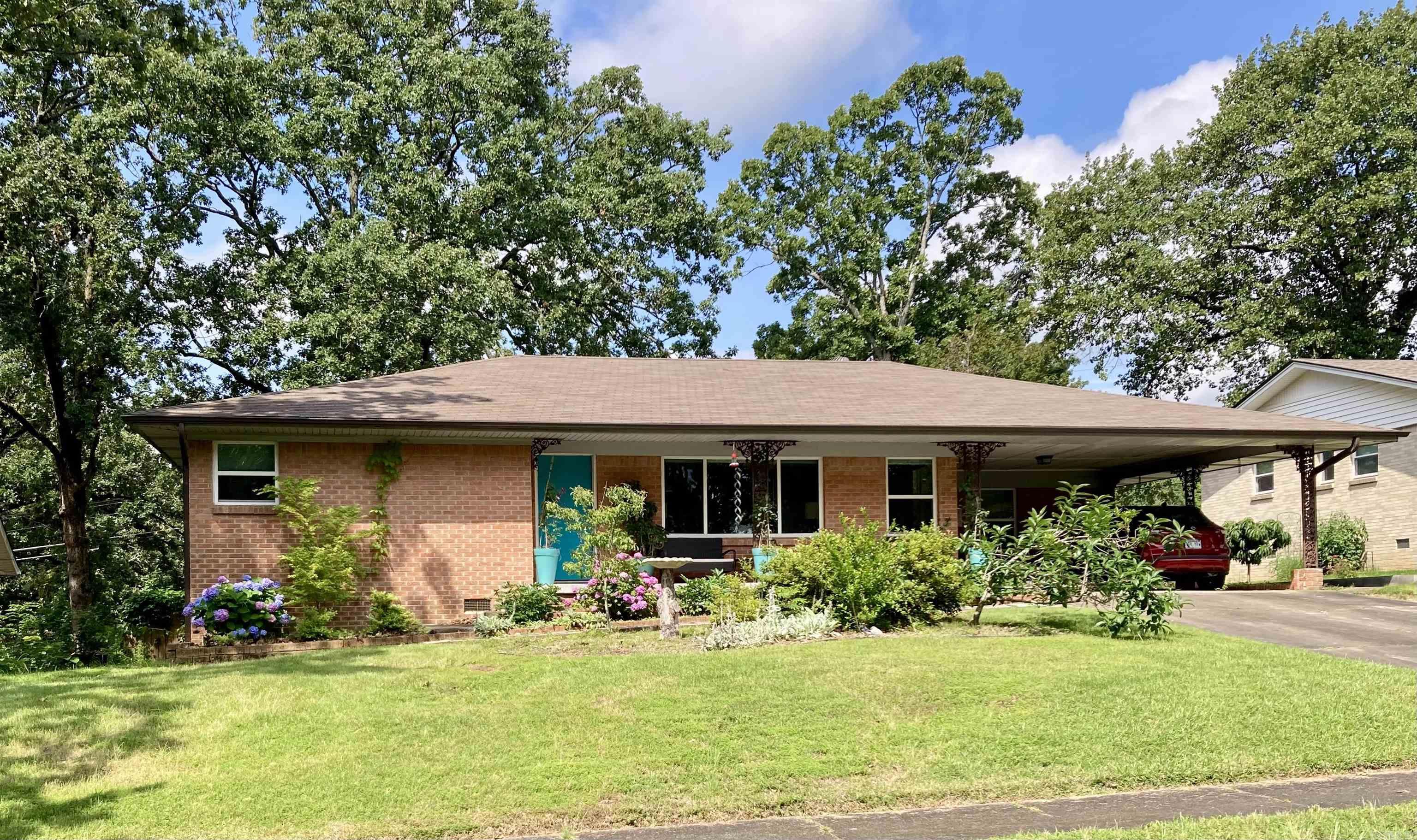Conveniently located off McCain Boulevard, this classic Lakewood home is loaded with original period touches, plus lots of modern updates, too. Wide open den/ family room to dining area features wood burning fireplace. Tiled kitchen w/ updated cabinetry, counters, and appliances. Extra living area/ office. Large master suite features two closets and pristine original, full, tiled bath. Spacious, tiled, hall bath serves bedrooms two and three. Beautiful refinished hardwoods, decorator colors through out. Updated roof, lots of vinyl windows, and more. Gorgeous plants, flower/ landscape beds and paths. Private, fenced backyard with large tiled patio and deck. Short distance to the Old Mill, the old swimming lake, and ball fields. *PLEASE SEE AGENT REMARKS!*