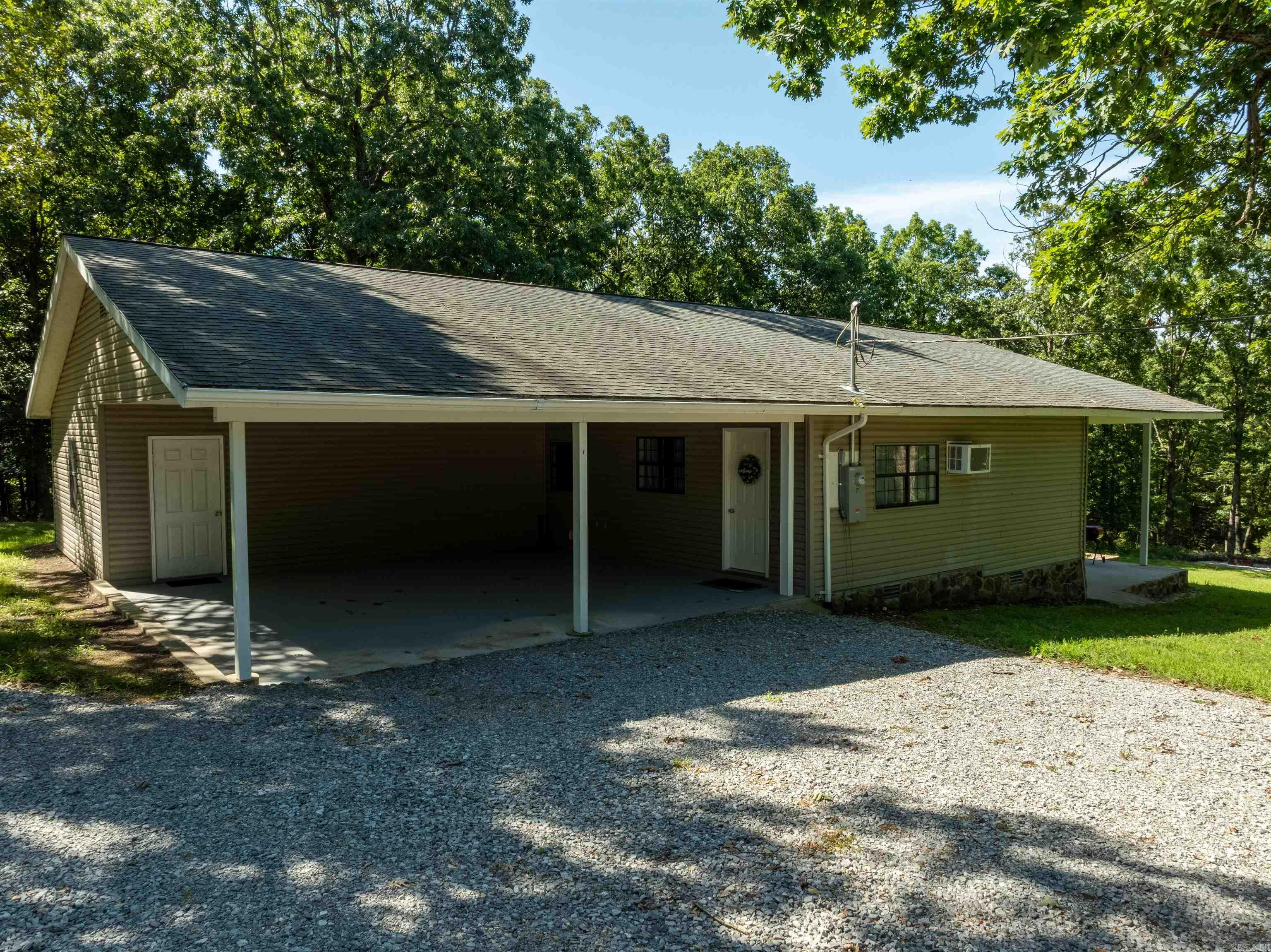 This charming home sits on 5.33 +/- acres just north of Batesville, offering the perfect blend of convenience and country living. With approximately 1,551 square feet of living space that includes two bedrooms, a bonus room, and two full bathrooms. The spacious master suite boasts a tiled walk-in shower. Seller states that the kitchen has been newly renovated with stainless steel appliances, and the home offers new flooring throughout. Step outside to enjoy a large screened-in porch, patio, and extended outdoor area ideal for relaxing or entertaining. A two-car carport is connected to a circle drive, providing easy access and plenty of parking. Call to schedule your showing today.