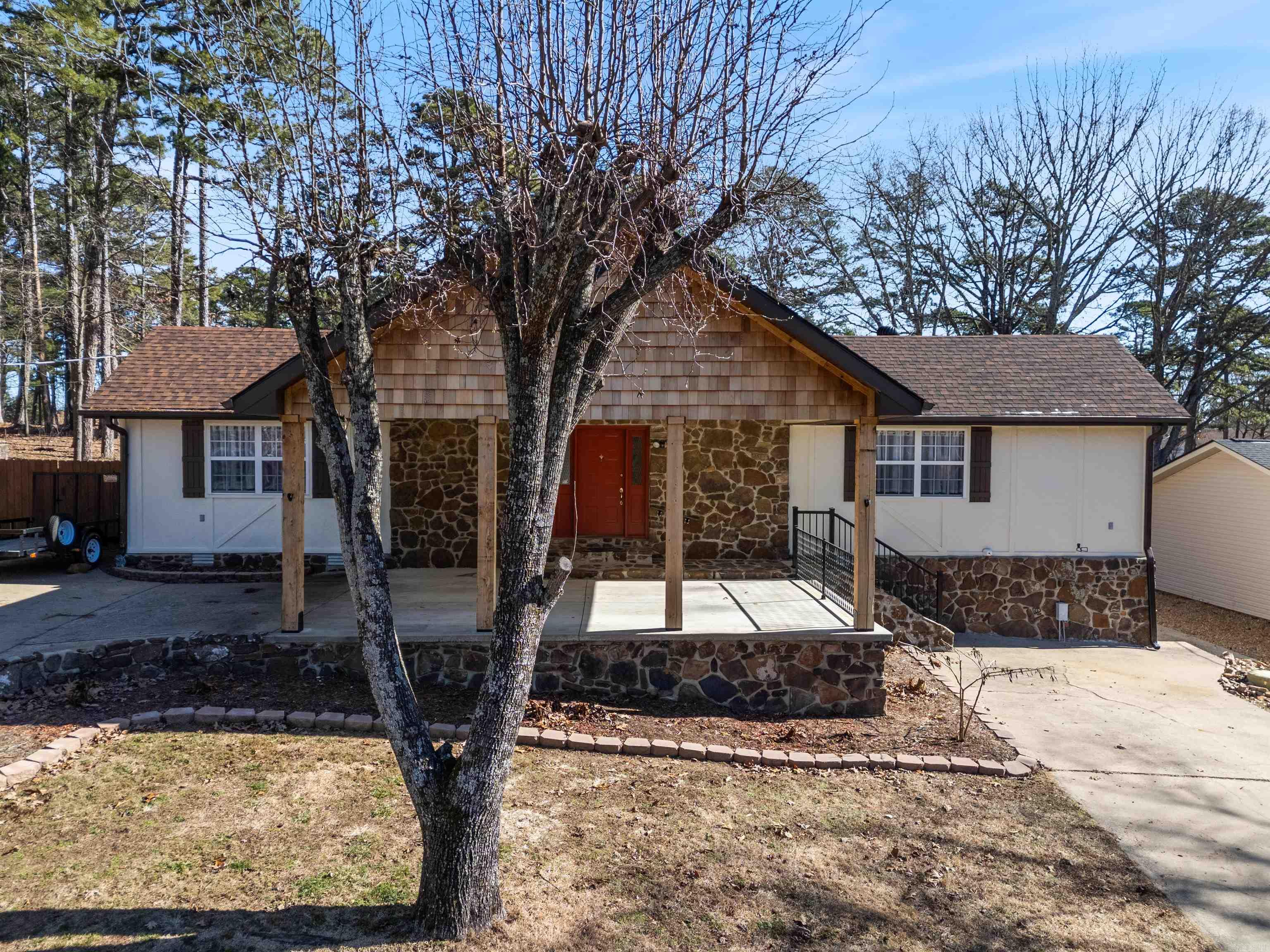Welcome to this exquisitely remodeled home on Indian Hills Golf Course. This property promises a lifestyle of relaxation & leisure because all of the updates have been completed so you can enjoy a day on the course & sunsets on the lake. Step inside to discover a thoughtfully designed split floorplan highlighted by large windows & the spacious living room/dining area with new ventless gas logs in the fireplace. The kitchen includes a new stove & vent-a-hood. The refrigerator, washer, & dryer convey w/ the sale of this property. Immerse yourself in comfort with a suite of 2023 upgrades, such as a brand-new roof, a cutting-edge mini-split hvac unit, & a high-efficiency HVAC unit, newly installed windows & elegant french doors, & many other updates including painting inside & out. Fairfield Bay comes with unmatched amenities, including access to 3 sparkling swimming pools, vibrant playgrounds, well-maintained tennis courts, modern fitness center, hiking & biking trails, ATV/UTV trails, pickle ball, 2-18 hole golf courses, bowling alley & pristine Greers Ferry Lake. There is a lower level area workshop/storage & the golf cart garage/storage building. Come enjoy the life. New sewer pump