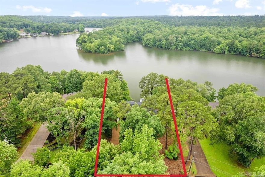 Absolutely STUNNING! This completely renovated waterfront gem is designed for effortless luxury and relaxation. With tons of natural light, the home feels open and inviting, perfectly complementing the stunning views of the water and trees.   It feels and looks BRAND NEW, blending modern elegance with high-end amenities. From the wood-burning and electric fireplaces to the walk-in shower, soaking tub, and ambient LED lighting, every detail has been thoughtfully designed. The oversized island, in the amazing kitchen complete with a scullery for extra prep space and storage, and wet bar just off the dining area make entertaining effortless, while the breathtaking views create a peaceful escape.  3 bedrooms that come with their very own en-suite for added privacy. Plus a half bath for your guests.  With geothermal heating and air, lots of outdoor deck space, a two-stall boat dock, a flag stone patio at the waters edge and an unfinished basement ready to be customized, this home isn’t just updated—it’s a fresh start in luxury lakefront living!  As an added bonus, you can enjoy the beauty of the surroundings with minimal yard maintenance, so you can spend more time soaking in the lakefr
