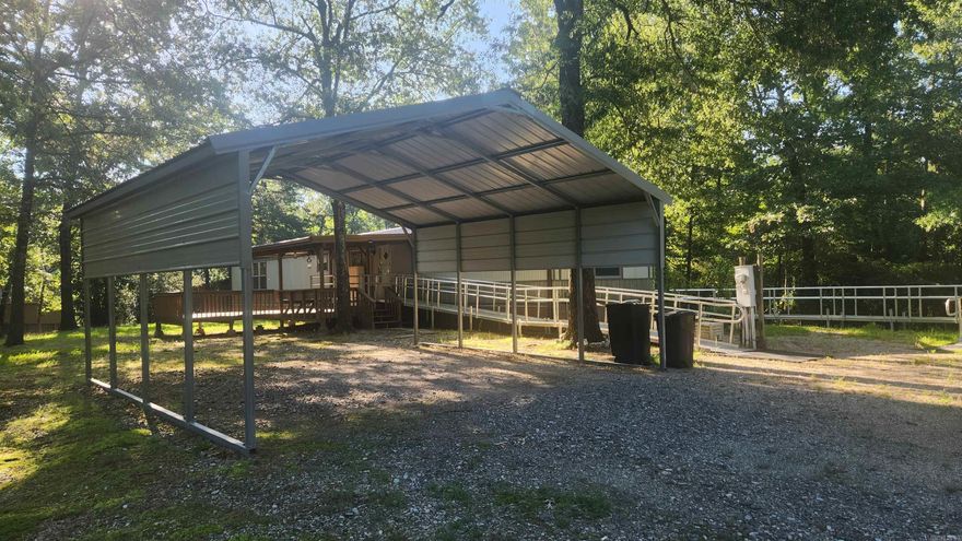 3 acres within walking distance of Lake Ouachita. No restrictions. 2006 Lexington single wide mobile 76x16. 3 bedroom, 2 bath. Handicap accessible with 2 metal ramps and shower. Central heat and air. Refrigerator stays. Porches on front and back. 30x30 metal shop with concrete floor, two 10ft roll up doors and a carport. There is an old survey. Home is on a well and has a septic. 20x20 metal carport. This was a vacation home for the sellers and not stayed in to often. It is quiet and fairly secluded.