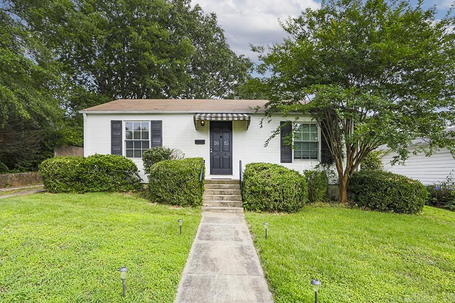 Classic and adorable, this Kingwood bungalow with metal/vinyl siding, newer composition roof and Anderson insulated windows. Gorgeous original hardwood floors, throughout coupled with updated bathroom finishes. Whole house generator, for uninterrupted power. Bright, well-flowing living/dining combo, kitchen with eat-in versatility for everyday meals. Large, gently sloped lot, great space for gardening, entertaining, or play. Plenty of space on the lot to expand living/bedroom areas and make this home everything you want it to be. Kingwood Place is conveniently located, and boasts Jefferson Elementary, Pulaski Heights Middle, and Central High as their zoned schools.