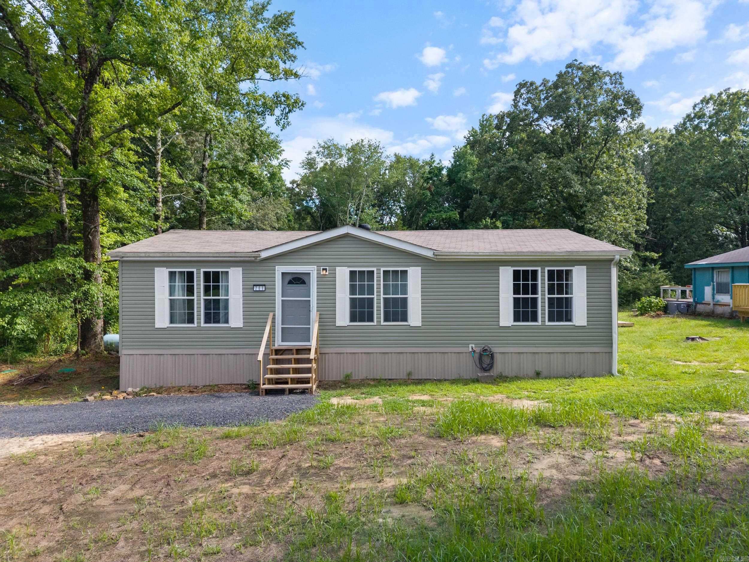 Welcome home to 268 Muscadine Lane! This 2007 3 Bed / 2 Bath home sits on .90 acres of wooded privacy, out of city limits, while also being close to the middle of town! The home was recently remodeled inside and out in 2024/2025. New exterior siding, new interior flooring, and new appliances. Refrigerator Conveys! This home is move-in ready, perfect for a growing family, investment property, or land to build your new home! Located in Cabot School District & close proximity of Little Rock Air Force Base! Can be purchased as a package with the neighboring home, 266 Muscadine Lane. Cash Only or Private financing, not eligible for Conventional / FHA / VA / USDA loans * Agents See Remarks for financing info + additional info *