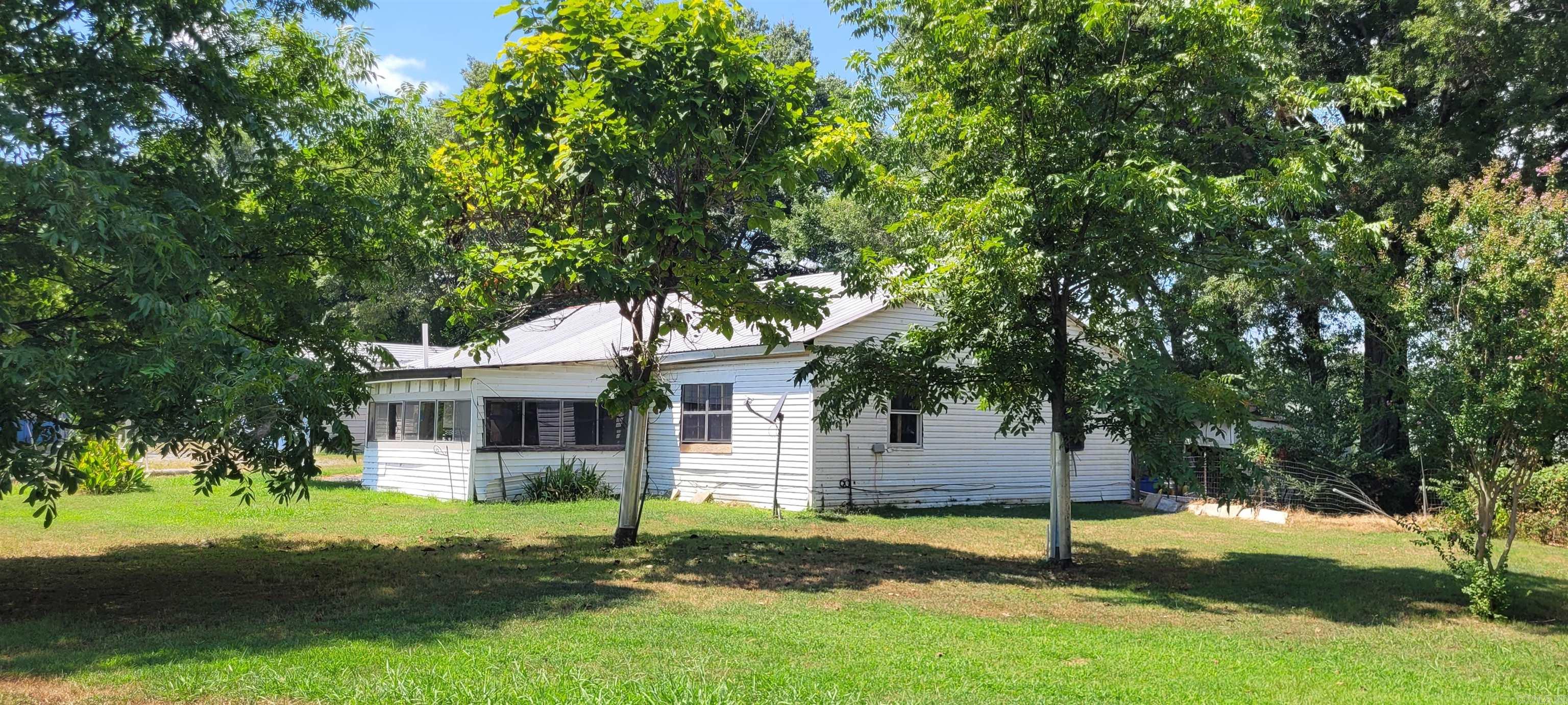 Fixer upper on just under half an acre with shop. Potential for investment property. No central heat and air. No utilities on.
