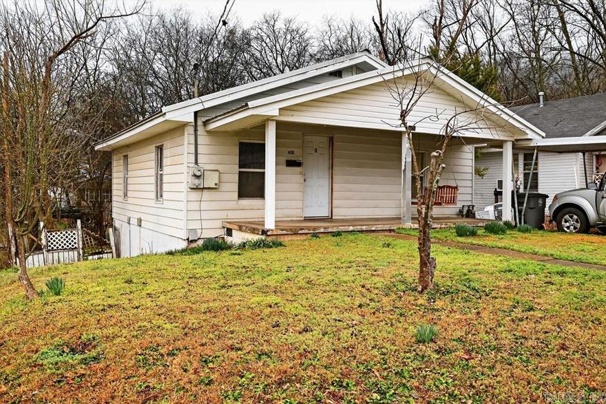 Outstanding frame home on a corner lot in a great location.  This is a great starter home or a rental property for investors in Hot Springs.  The home comes with the refrigerator, washer and dryer.  Call today to setup an appointment to show this home.  The basement provides room for lots of storage.  The home has central heat and air for year-round comfort.   Call today to setup an appointment to show this home to your clients.