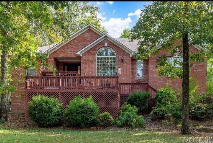 This home is a stunner! Featuring a brand new roof and an inviting multi-level front deck with beautiful views, it's perfect for enjoying the outdoors. The backyard offers privacy with a brick wall, iron fencing, a covered porch, and lots of trees. Inside, the kitchen is a chef’s dream, complete with an island stove, copper sink, double oven, and a cozy eat-in area with French doors leading to the porch. The laundry room is well-equipped with cabinets, double sinks, and an ironing board, while the open dining area boasts a large picture window. The spacious living room includes an electric fireplace, 10-foot ceilings, and built-ins for extra storage. The master suite features cathedral ceilings, an electric fireplace, and a large picture window, with a luxurious master bath that includes a shower, jetted tub, marble sink, and a walk-in closet. Hardwood floors flow throughout the home, including the master bedroom, with tile in the bathrooms and laundry, and carpet in two bedrooms. Extras include a washer and dryer, a new garage door, and updated front decking in 2024. See agent remarks for additional details!