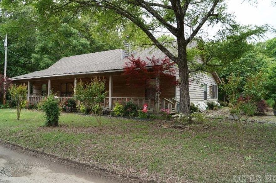 Your own piece of paradise awaits in the upscale "cabin" on the White River.  It's crappie fishing at its best!  The dock is about 1 min. away and includes 1 boat slip.  This custom home features high vaulted cedar ceilings and walls in the open livingroom, kitchen, and dining area.  Bedrooms are sheetrook.  The mantle and interior bar were custom built with cedar by the builder.  Tell your fish stories around the firepit in the evenings and catch the game.  Yes, it's wired for TV! *Agents-see remarks*
