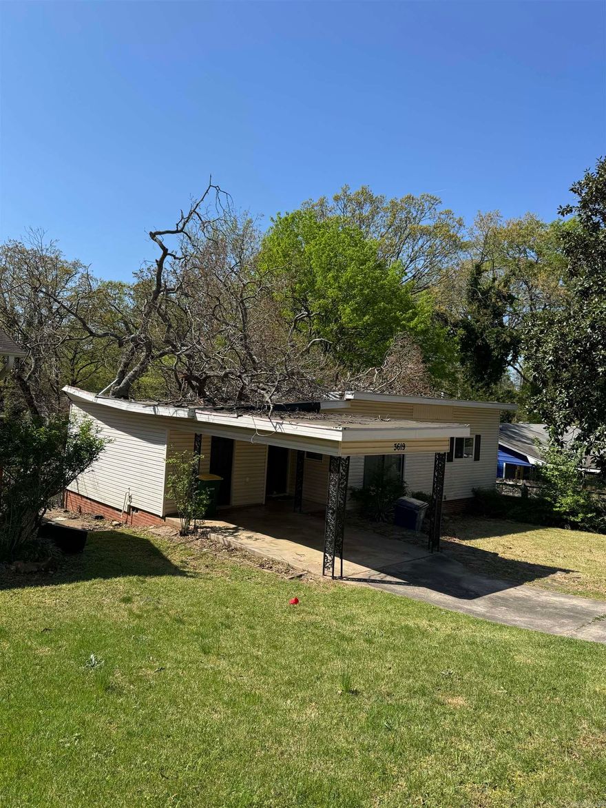 Investor Special.  This would be a great place to build a new home.  Lot value only.  Home may be a total loss due to tree damage.  Please sign the hold harmless located in the Associated Docs before entering the property; showings will not be approved until this has been submitted to listing agent(s). No Seller Property Disclosure!!