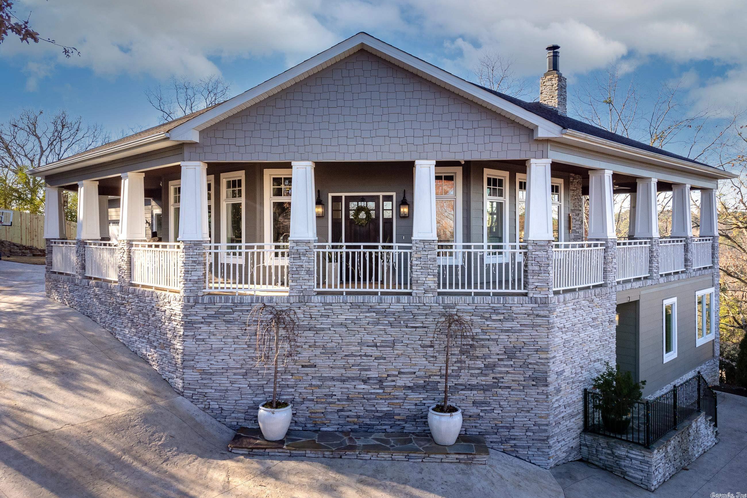 Situated in Overlook Park, this craftsman style home offers phenomenal views of the AR River!Welcoming floor plan w/ 10ft ceilings extend thruout main areas of the home.KIT features honed Carrara marble cctops, farmhouse sink, walkin pantry w/ builtin shelves & counter space.Main level includes LG master w/ massive walkin shower & fabulous MST closet w/access to laundry & pet wash station. Safe room.Wood-burning outdoor FP & built-in heaters on the patio allow for yr around enjoyment of the amazing sunsets.
