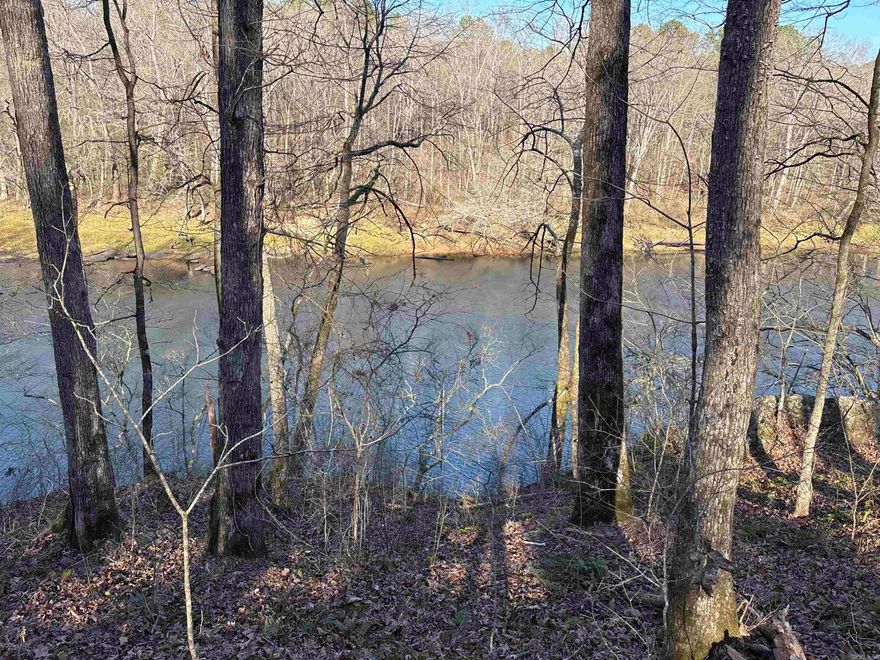 135+- acres located next to Baptist Hospital and Doctors office park in Heber Springs Arkansas. (HUGE DEVELOPMENTAL PROPERTY RESIDENTIAL & COMMERCIAL)  The Little Red River flows on the North side of property offering views that are extraordinary.  On the South side of Property you can build a home and wake up to a view of Sugar Loaf Mountain filling your bedroom window.  To the West you have a vista view of the mountain ridge surrounding Heber Springs.  Property has a gravel road system that can support heavy traffic going and coming.  The road system takes you down to the river within a few yards.   The property has a  secondary entrance on the south end of the Property using county road.  This oasis can be divided into residential/ commercial/ agricultural use.  City water/Sewer/electric are available on the property.  Very few acres are not usable across the entire tract.  A nice pond in the middle of the property, and the owner has divided the property into three tracts utilizing cross fence for cattle production.  Mature hardwoods are located on the hillside adjacent to the river.  Pasture is encompassing most of the property with amazing views in every direction!