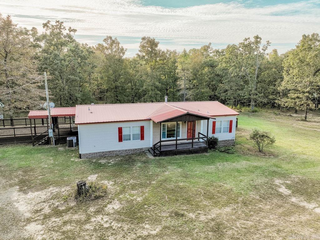 Just minutes from the boat ramp, this 3-bedroom, 2-bath home offers the perfect blend of comfort and convenience for lake living. Enjoy a spacious open kitchen that flows into the living areas, plus a bonus room that can be used as a game room, office, or second living space. The home also features a separate laundry room for added functionality. Outside, you’ll love the cleared front yard, ideal for gatherings or extra parking, while the wooded backyard provides privacy and room to explore. Whether you’re looking for a full-time residence, weekend getaway, or investment property, this home puts you close to all the outdoor fun Greers Ferry Lake has to offer.
