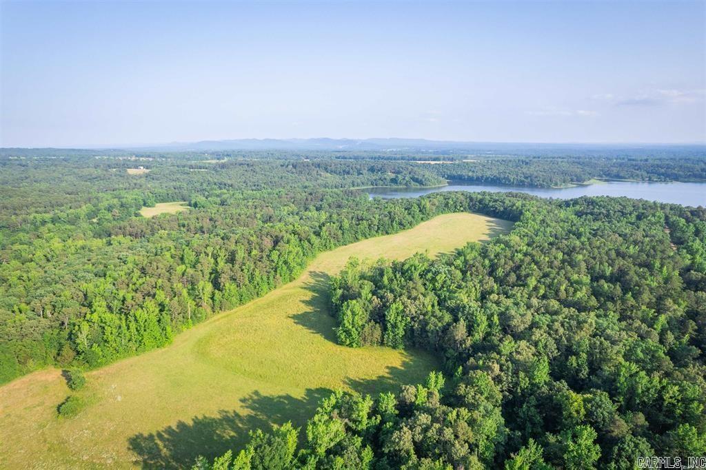 Nice mostly Wooded Land close to 200 acre Lake Wilhelmina, great for fishing! Rural Water and electric down easement road. Great views of Rich Mountain! Possible Owner financing available. Some restrictions apply. See agent remarks