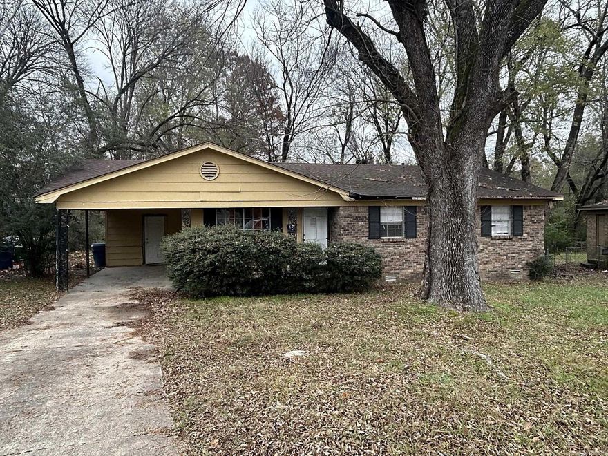 Located in the Geyer Springs area of southwest Little Rock, this property sits within a long-established residential corridor offering quick access to major roads, retail, services, and employment centers. Enter from the carport into a kitchen/dining combo that anchors the floor plan; double doors from the dining area open directly into a large backyard, offering excellent potential for outdoor living or future improvements. To the right, a living room provides a central gathering space, while to the left a hallway leads to the bathroom and three bedrooms, creating a simple, rental-friendly layout. Laundry Room is located under carport. For investors, the location, layout, and lot size present an opportunity to reposition the property in an area where similar homes have historically supported consistent rental demand and resale activity. Property is sold as-is; buyers should conduct all inspections and due diligence.