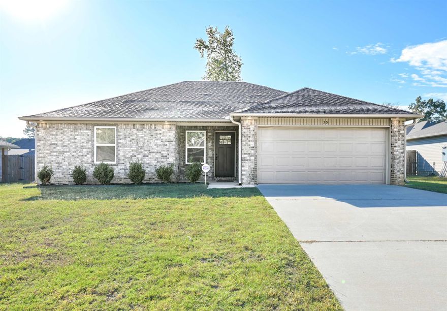 Beautiful brick and siding home featuring an open floor plan with vaulted ceilings! Kitchen includes granite countertops, stainless steel appliances, and custom trim details throughout. Modern finishes include LVP flooring, tile and beautiful fixtures.  Enjoy a private, fenced yard with covered patio— all in a great location close to everything!