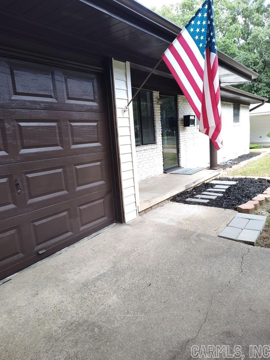 BEAUTIFUL HOME! FRESHLY PAINTED! ORIGINAL HARDWOODS REFINISHED! BONUS SUNROOM. LARGE STORAGE BUILDING. HUGE YARD. NEW THICK LUXURY VINYL. EXTRA Parking Pad.PULL Your Vehicle/Trailer in back yard.  2 Bathroom's