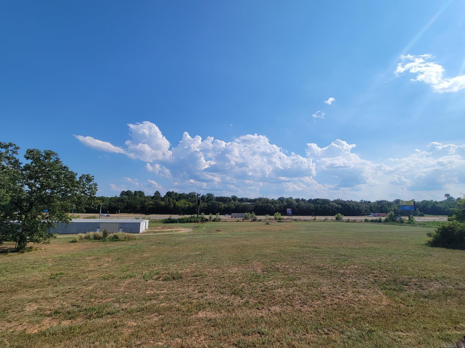 Prime Commercial Property with I-40 Frontage – 16 Acres with 25,000+ Sq. Ft. of Space Looking for maximum visibility and endless potential? This rare commercial opportunity offers direct frontage on Interstate 40 in Plumerville, Arkansas, with billboard income potential already in place. The property spans 16 acres and includes five buildings totaling approximately 25,000 square feet of versatile space. With recent extensive improvements, the site is primed for a wide range of uses. Unmatched visibility with I-40 frontage and billboards 16 acres of land for expansion or redevelopment Five buildings providing 25,000+ sq. ft. of usable space Strategic location between Conway and Morrilton, offering access to central Arkansas markets Whether you’re an investor, developer, or business owner seeking a high-traffic location, this property delivers visibility, space, and growth potential.