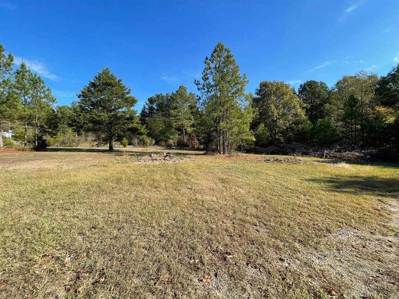 Welcome to Glazy Acres! This property spans over 3 acres of lush landscape. All utilities are located on the property. Fantastic location just minutes from shopping and restaurants. Approximately 15 minutes from Lake Ouachita State Park! Seller requests a minimum $1,000 earnest money when submitting an offer. Back on the market no fault of the seller.
