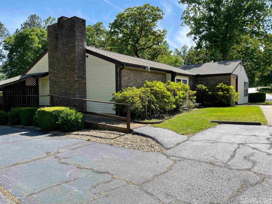 No steps! Level 3/2 on end in coveted Huntleigh Woods! New roof 2020, all trees recently trimmed.  Beautiful deck (there are steps here to go down to grass but you can go around!) Clean and within walking distance of the clubhouse where there are many activities as well as in ground pool and hot tub. Babbling creek in back and plenty of grassy areas if you have a furry friend! Large laundry room, Wood burning fireplace. Close to everything! Call me today!