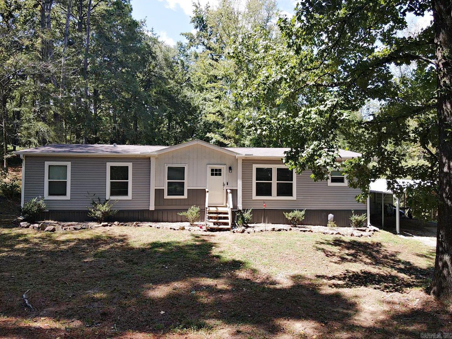 Looking for a quiet getaway, search no more! Secluded setting yet minutes from Lake Degray State Park and Golf Course and only a short drive to historic Hot Springs National Park. Beautiful doublewide manufactured home with cover parking at the end of a quiet street. Spacious home with open floorplan. Mature trees and privacy.