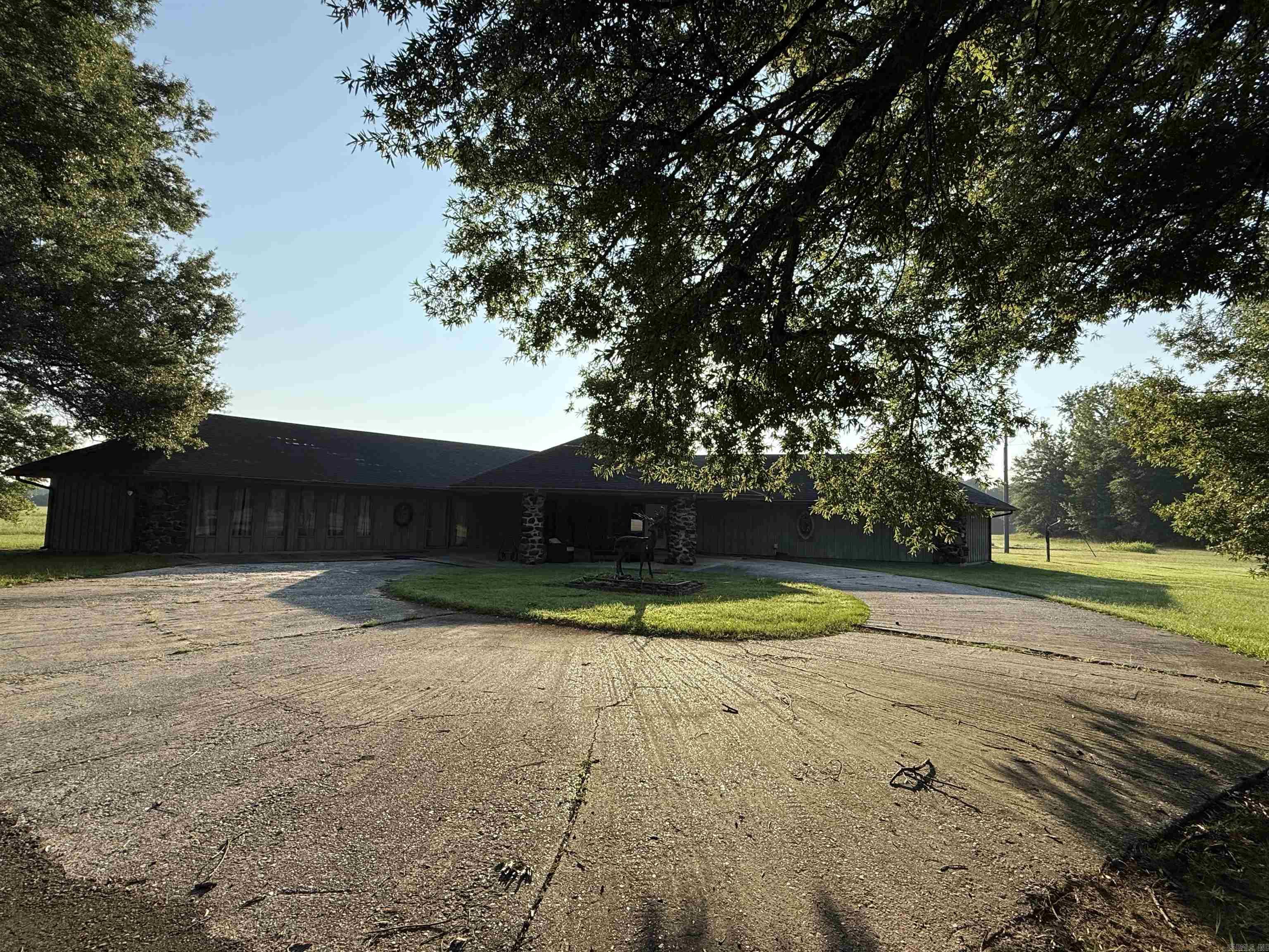 Property located on the east side of Blevins, offers a custom built home with over 3,490 sq ft of living space and 40 acres, currently pristine hay meadow, two ponds, one is spring fed. This unique home offers a split floor plan, entry way, step-down living room with gas-log fireplace. Chef's kitchen includes: stove, refrigerator and dishwasher, breakfast bar and sitting area, separate formal dining area and oversized laundry room with cabinets and sink. Master suite offers private sitting area, double closets, master bath with garden tub and separate shower. 2 additional bedrooms and 2 full baths and a half bath. Home has two CH/CA units, rural water, optional well water, circular concrete driveway with covered parking/patio. Fenced on 3 sides, additional private drive w/electric meter north of the house. Contact our office for more details or to schedule a private tour.