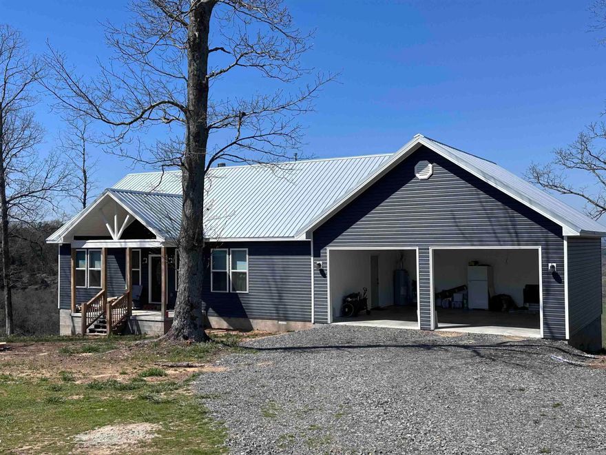 Brand new construction in 2023 all on 15.6 acres.  This home has a gorgeous view of the valley. The back deck is ideal to enjoy as you enjoy your morning coffee and evening sunsets. You will find 3 bedrooms on a split floor plan, 2.5 baths, open kitchen & living area with granite counters and wood burning fireplace.  Great home for entertaining. Also includes a walk out basement, storage building, barn and RV hookup.  If you are looking for peace and tranquility, this is the property for you!