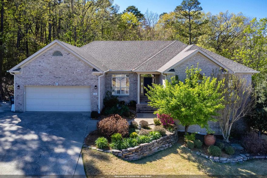 Beautifully updated Chenal home in a cul-de-sac w/ wooded green space behind for privacy. Kitchen recently updated with new tile, backsplash, paint, fixtures, hardware & walk-in pantry; Large living area with double-sided fireplace, vaulted ceiling, and wall of windows with a gorgeous wooded view; hardwood floors throughout main level including bedrooms; primary bath also recently updated with a gorgeous tile shower and soaker tub, quartz counters, paint, fixtures, and hardware. Downstairs area features a bonus/game room with a wet bar, 1 BR/1 full bath, that would make a great in-law quarters. Also has an additional office with a cedar closet PLUS a storage room/workshop with outside access to a fenced area of the backyard and beautiful wooded area. Bonus features include a sprinkler system, central vacuum system, plantation shutters, oversized garage and parking pad for an extra car. Main level HVAC unit is new. Agents, see remarks.