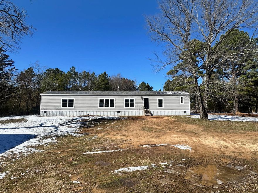 Discover peaceful country living in this beautifully maintained manufactured home situated on 1.28 acres of open space atop Lutherville Mtn. This modern move-in ready home offers the perfect blend of comfort and convenience, with a spacious layout! This 3 bedroom, 2 bath home has bright and airy interiors, an open-concept kitchen and living area, separate laundry room and large bedrooms. This property is fully fenced with a gated entrance, a 40x30 3 stall metal pole barn, a 10x8 new metal shed for storage, and a new chicken coup that has a fully fenced area. Whether you're looking for a starter home, downsizing, or a private retreat, this property has it all!! Located just minutes from town amenities. Call today to schedule your showing!