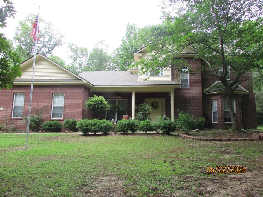 Looking for privacy? This is the one!! Nestled in the woods, this nice 4 bed, 3 bath home has so many extras to offer. Large open kitchen with a breakfast bar, nice pantry and a built in desk  Breakfast area and den share a two sided gas fireplace. Primary bedrm downstairs and the primary bath has double vanities, jetted tub and a separate shower. Formal dining room and  the guest bedrm/office down stairs. 2 bedrooms and a full bath upstairs. HUGE walk in attic perfect for storage or converted to a bonus room. Bamboo flooring in 2015, new carpet 2021, new water heater 2021, roof 2023, garage door 2022 and dishwasher 2025. Home was wired for security system but they never installed it. Fenced area in back yard. Large storage shed. What else could you want. **Agents see remarks**