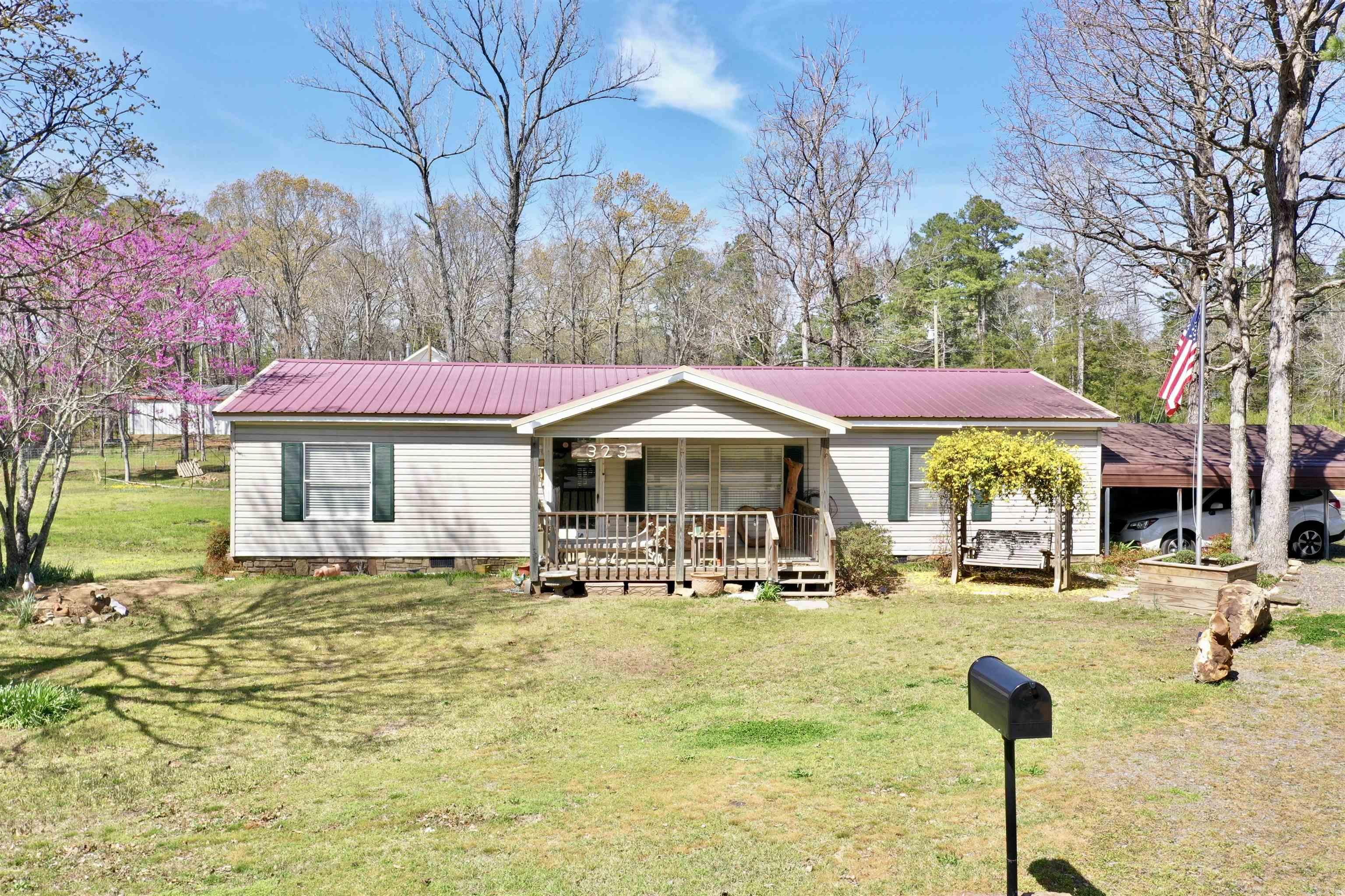 This 3-bedroom, 2-bathroom mobile home is perfect for a getaway, vacation rental, or full-time residence, located just outside Sugar Loaf Recreational Area and Marina on Greers Ferry Lake. With 1,352 sq. ft. of space, it features covered front and back porches, a fenced backyard, a covered carport, and a storage buildingāideal for storing your lake toys. Lots of natural light shines in on the freshly painted walls for that clean and bright feel. Bring the family and enjoy the perfect lakeside retreat!