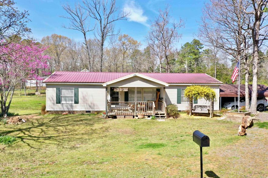 This 3-bedroom, 2-bathroom mobile home is perfect for a getaway, vacation rental, or full-time residence, located just outside Sugar Loaf Recreational Area and Marina on Greers Ferry Lake. With 1,352 sq. ft. of space, it features covered front and back porches, a fenced backyard, a covered carport, and a storage building—ideal for storing your lake toys. Lots of natural light shines in on the freshly painted walls for that clean and bright feel. Bring the family and enjoy the perfect lakeside retreat!