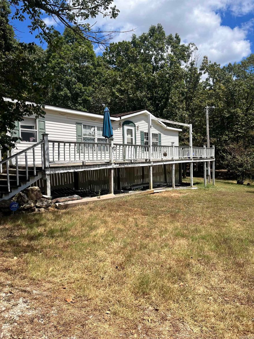 This 3 bedroom, 2 bath manufactured home sits on a permanent foundation and offers peaceful country living on 6.11 acres. A spacious wrap-around porch invites you to relax and enjoy the views, while the property is equipped with practical amenities including two portable carports, two sheds, a storm shelter, a well house, and fiber optic cable for modern connectivity. The home needs a little TLC, giving you the chance to add your own touch, but major updates are already in place—roof replaced just 3-4 years ago. Conveniently located only 15 minutes from Melbourne, 30 minutes from Cave City, and 30 minutes to Ash Flat, this property offers both privacy and accessibility. Perfect as a full-time residence or a weekend retreat, this home is ready for new owners to make it their own.