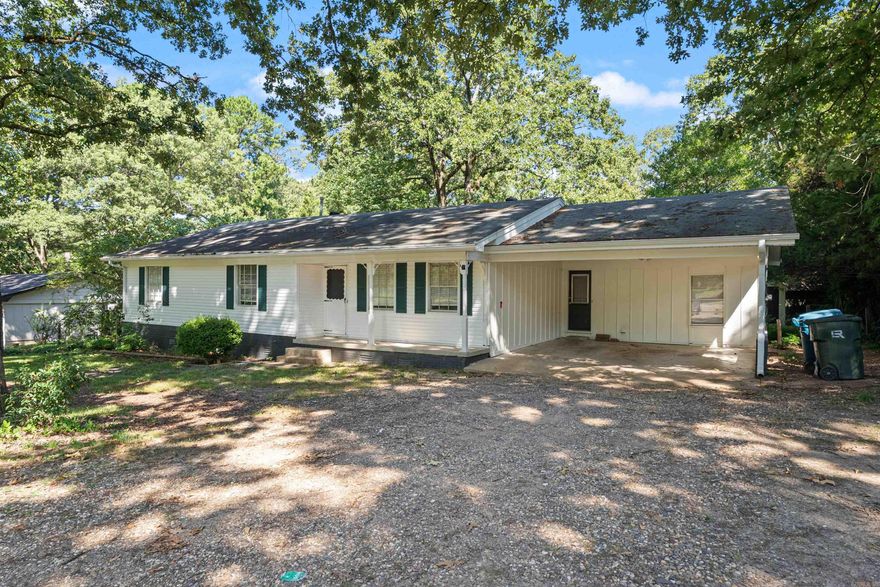 PRICE UPDATE!! Nestled on a lush 0.7-acre lot with mature shade trees, this charming 1955-built single-level traditional offers 1,604 sqft of comfortable living in the serene city of Alexander. The stylish brick-and-vinyl exterior hosts a two-car carport. A spacious, fenced backyard creates a private, park-like retreat—perfect for outdoor living and entertaining.  Inside, discover a 3-bedroom, 2-bath floor plan. A generous laundry room adds everyday convenience. Come tour this amazing home, that boasts a welcoming environment with room to gather!
