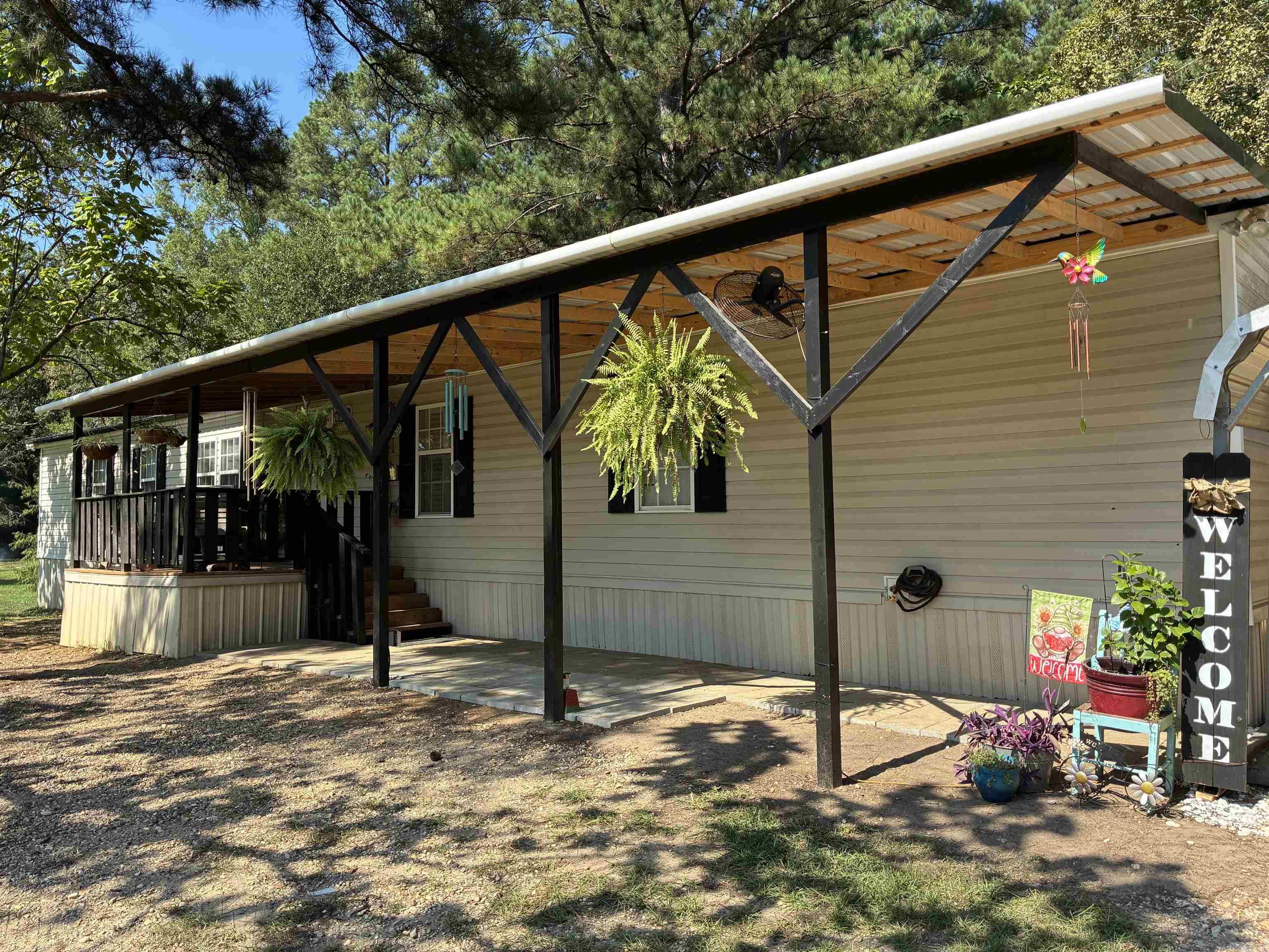 Affordable Country Living on 2 Acres Welcome to 2067 Hancock Rd, a peaceful retreat located just outside Crossett. This 2005 1,425 sq ft mobile home offers 4 bedrooms and 2 full bathrooms and sits on a 2-acre lot. Updated neutral interior paint and flooring. Whether you're a first-time buyer, investor, or someone looking to downsize and simplify, this property offers incredible value and potential. It could be your cozy country haven or a smart addition to your portfolio. Located just minutes from town, yet far enough to enjoy the peace and quiet of country life. METAL ROOF 2023, BEDROOM ADDITION 2023, HWH 2022. Listing is for the mobile home, shop and land. All additional outbuildings will be removed.