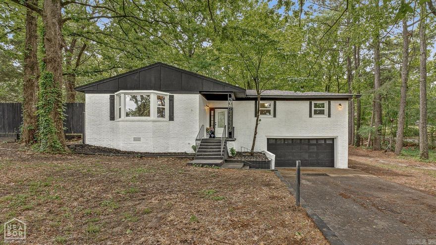 This charming home is a must see. It's located in the desirable Hilltop area. This home blends space, updates, and location perfectly. It features 3 bedrooms, 2 1/2 bathrooms. The lower level basement could be used as a bonus room ideal for a mancave, office, gym, playroom, or cozy retreat. It also offers a small safe room. Every room in the home has been updated with new flooring, freshly painted ceilings and walls and new lighting throughout. Major updates such as new roof and HVAC both installed in the last few months, new windows offer peace of mind and value for growing families. Beautiful tiled shower and a free standing soaker tub. The spacious great room is perfect for entertaining, complete with a gas-log fireplace. There is a bay window that lets in lots of light. Beautiful back deck with secluded back yard and wonderful shade trees. Additional features include nearly 2100 square feet of living space, a 2 car garage with interior entry, and a dedicated laundry area. Located in the Nettleton School District, just minutes from dining, shopping, and the NEA Baptist Hospital. This home offers in-town convenience with a peaceful retreat feel.