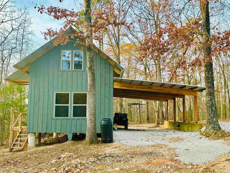 Looking for a cozy Craftsman built cabin nestled in the beautiful Ozarks just minutes from the world renown White River, and the eateries, shops, and folk music in historic downtown Mountain View? This is a great location with beautiful woodland views! This newly constructed unfinished/dried-in cabin is being sold with 3 acres MOL and is conveniently located only 1.4 mi off scenic AR Hwy 66. The appealing exterior of this well-built structure has a large, covered area with exposed heavy timbers, Galvalume metal roof, quality insulated doors and windows, and a small back porch at the rear exit. The interior's first floor is an open canvas ready for you to design and finish out to your heart's desire. The large loft area could serve as a nice bedroom, office, or bonus room. Electric and public water at road. Private septic required. The cabin is tucked-back privately into the wooded acreage away from the road for a quiet peaceful setting with an abundance of wildlife, white-tail deer, and small game. Whether you're an avid hunter or just a lover of nature, the location and natural beauty of this property will not disappoint. Call today for more information or to view!