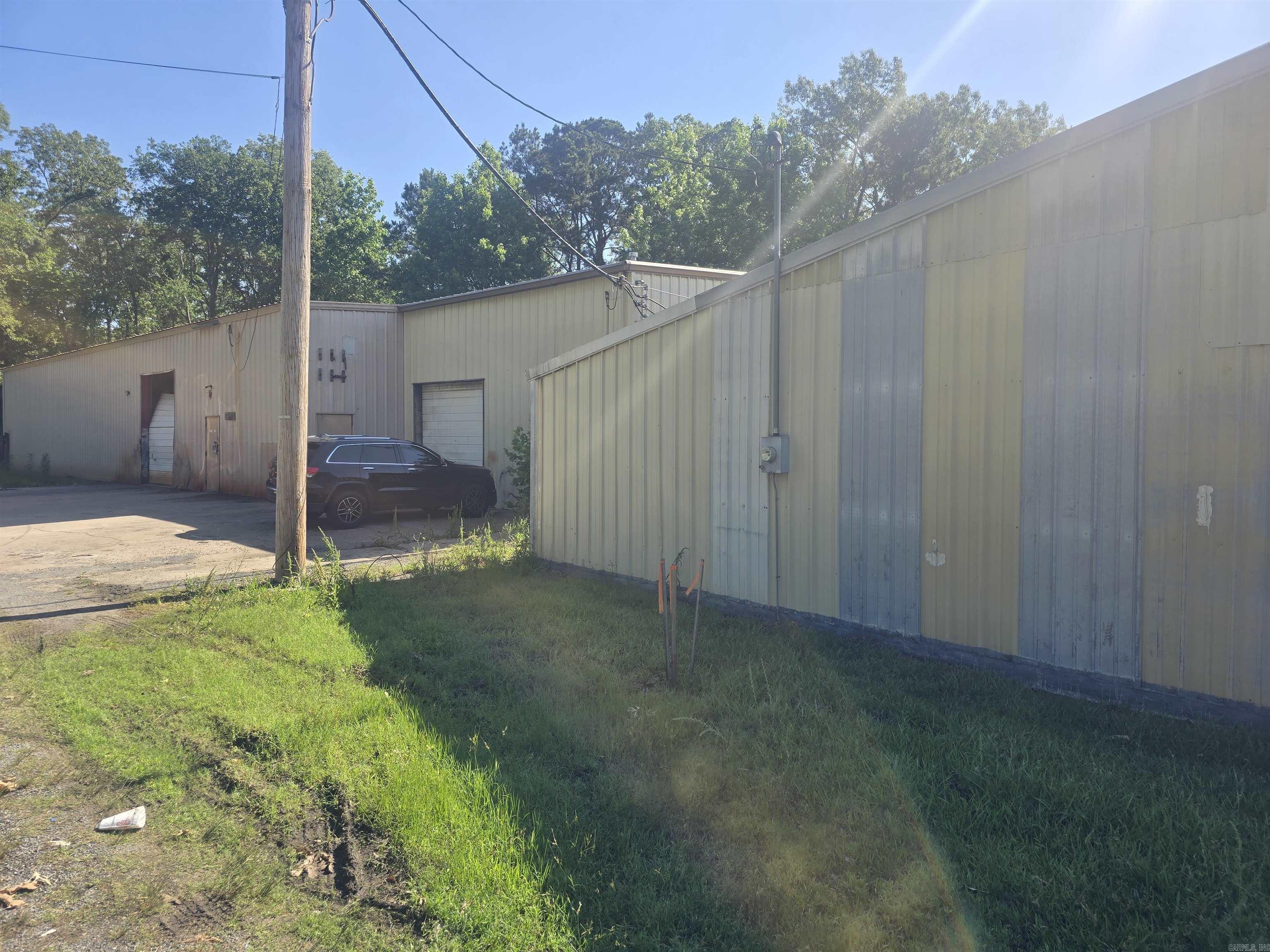 TWO warehouses! Prime commercial opportunity on the corner of high-traffic Sheridan Road and Jackson offering excellent visibility and accessibility, making it an ideal service-base business location! Call today for a showing!