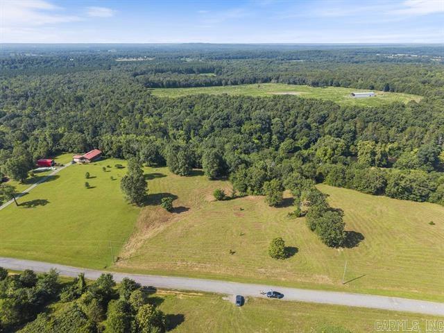 Discover the perfect blend of natural beauty and privacy with this rare 5-acre parcel nestled in an established restricted subdivision along the Cadron Creek. Offering approx. 300 foot of creek frontage, mature trees, and gentle rolling terrain, this property is ideal for your dream home!!! No mobile homes allowed. The back portion is in the flood zone. Call me today for more information!