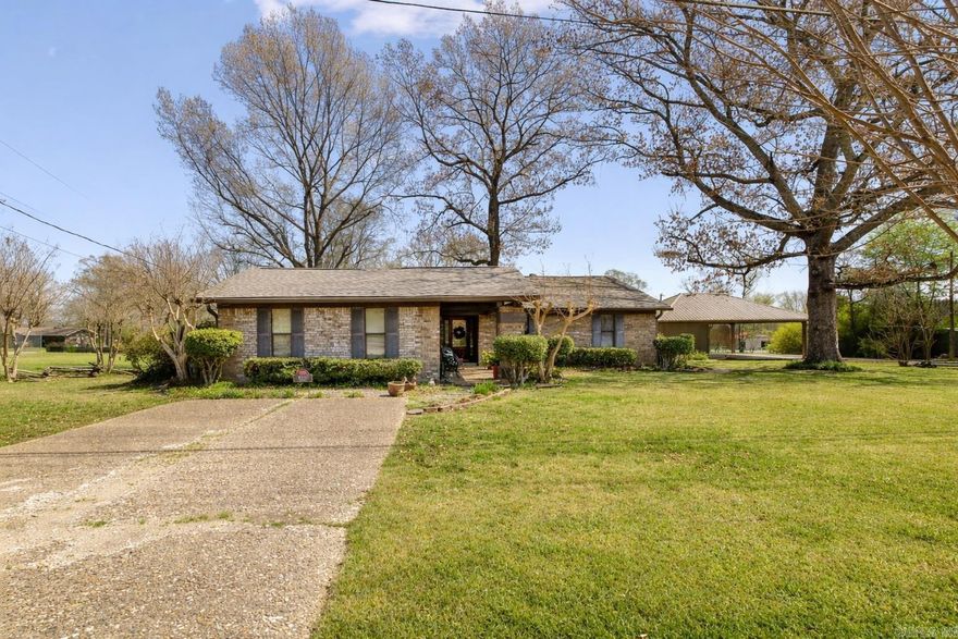 ONE LEVEL HOME IN SALEM ON ACREAGE WITH A POOL! Rare opportunity to own a private, in-town retreat on a full acre! This 4 bed, 2 bath home offers an updated kitchen with breakfast bar that opens to a spacious dining area. The inviting living room features vaulted ceilings with painted beams, built-ins, wood floors, and a wood-burning fireplace. Enjoy the sunroom year-round, plus great storage throughout, including a huge walk-in closet. The backyard is perfect for entertaining with a pool, large deck, and covered porch. Includes 2-car carport, whole-house generator, storm cellar, and a 1-year-old roof. Located in Bryant School District!