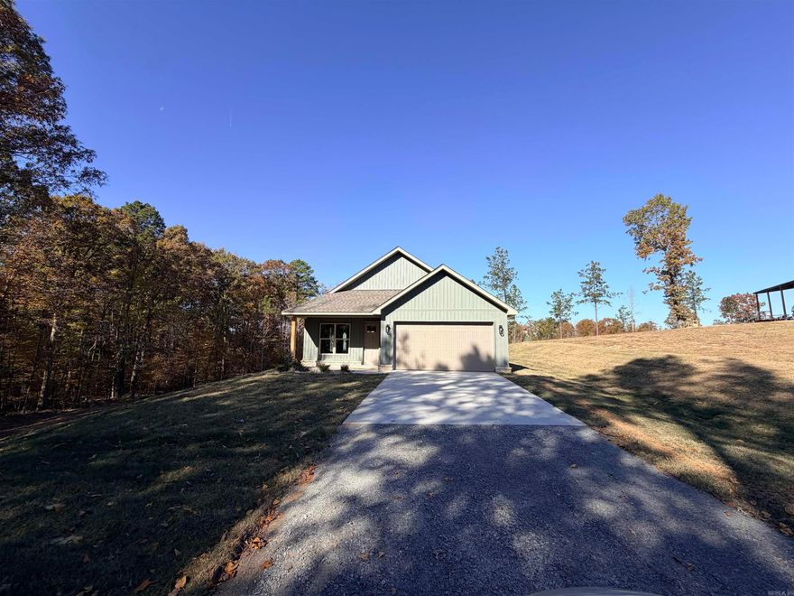 Stuning new construction home with space and plenty of room on 3.4 acres.   Open kitchen and living room, Kitchen offers a large island, custom cabinets, and pantry. This home is in the country with a beautiful setting.