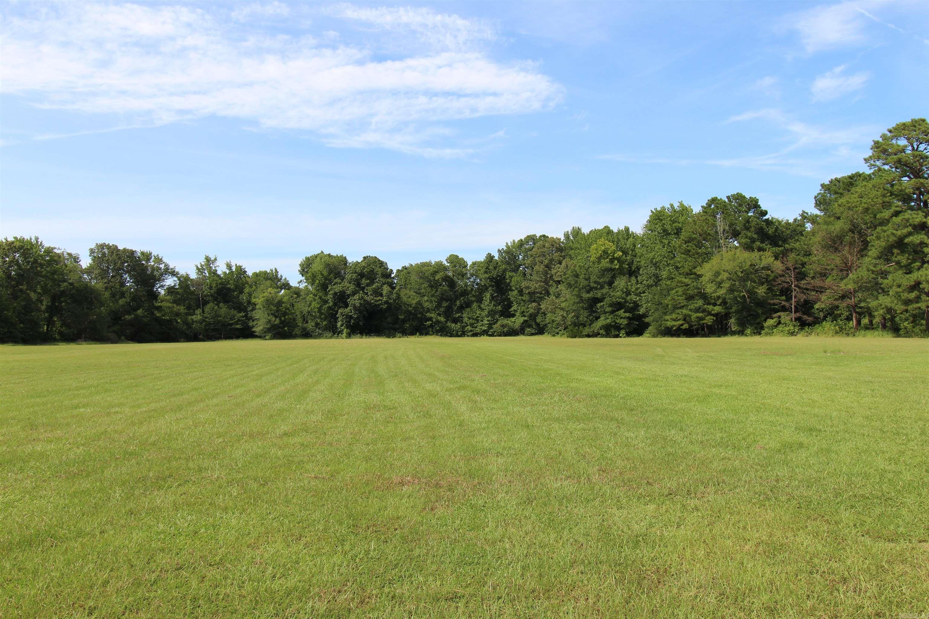 Bring your horses and kiddos*really nice land*beautiful pasture*nice woods*deer galore*in the boondocks lol*very private but has city water*it's hard to find pastureland*current survey*all kitchen appliances stay*completely remodeled 3 years ago*new plumbing 3 years ago*storm cellar*avg monthly electric $120-$150* Because this is a single wide, it will not qualify for a FHA, VA or RD loan*sellers ask that buyers are preapproved before looking*