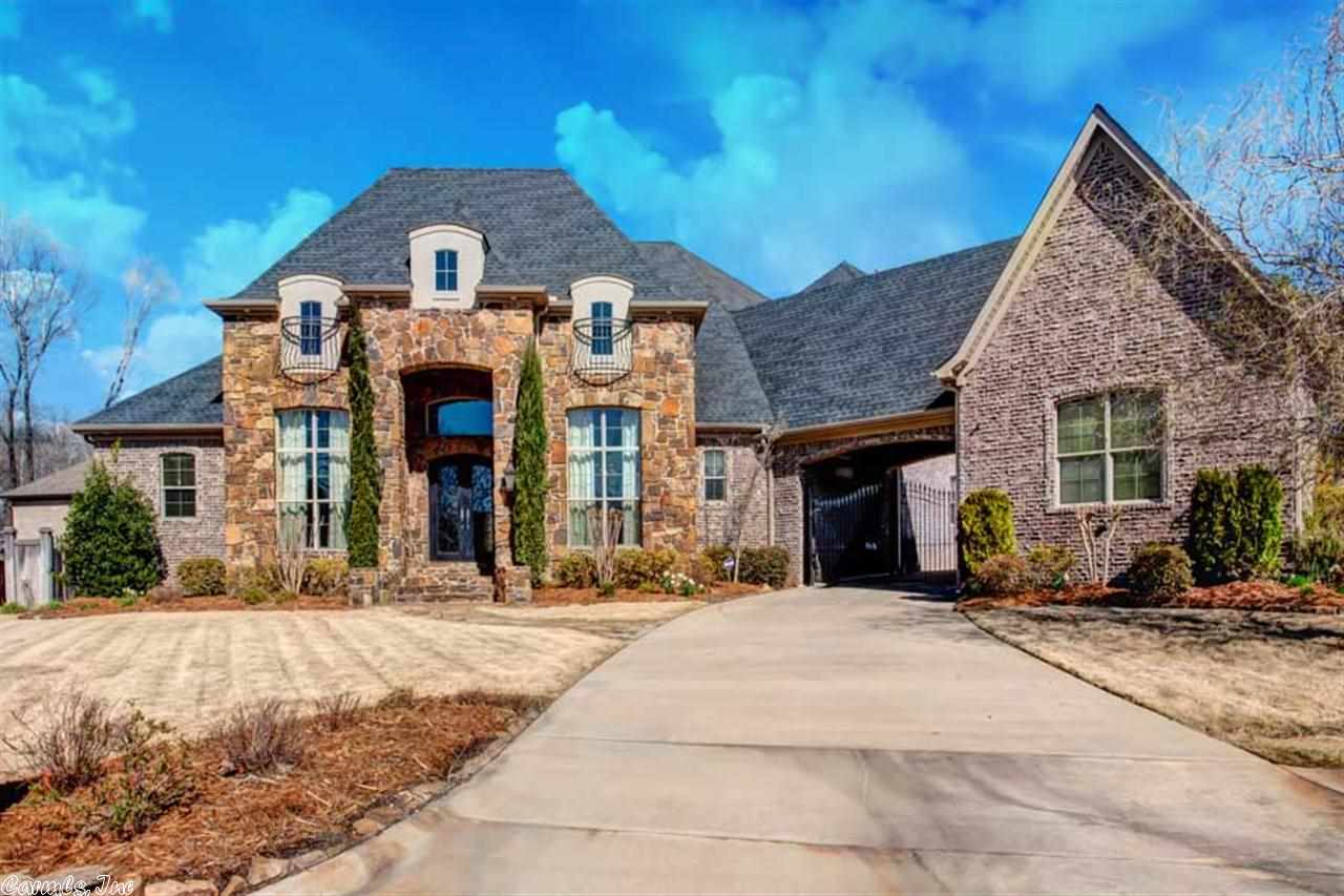 Custom estate on cul-de-sac. Flagstone, metal scroll door, handscraped hardwoods, butler's pantry, reproduction knobs & weeping mortar brick. Maple black cherry stain cabinets, extensive built-ins & mud room. Hearth room kitchen- 2 dishwashers, island, 6 burner/griddle, pot filler, granite & built-in refrigerator. 6" Baseboards, central vac & massive laundry w/ 2 W/D outlets. Master suite has FP, sitting area, claw tub & river rock shower. Gameroom w/ kitchen. Outdoor FP, patio & pergola. Entertainers dream