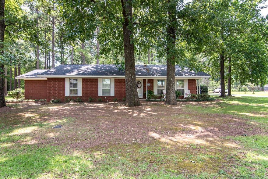 Very well maintained and move in ready!  Situated on FOUR lots and designed with entertainment in mind, this amazing 3 Bedroom/3 Bathroom home offers endless options with the very versatile floor plan featuring 2 living rooms and 2 dining rooms centered by the perfect kitchen to make all your culinary dreams come true!  You will love beginning and ending each day in the extra-roomy primary suite equipped with a jacuzzi tub, stand-alone shower, and a closet that you won't believe!  The outdoor oasis is loaded with shade trees, a 30*24 shop, 15*40 RV shed, and an 8*12 storage shed!