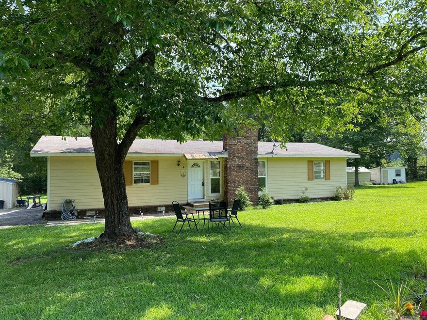 If you like the idea of having a place to garden, pick fruit, raise chickens, a fenced in area for your dogs, storage shed on three acres and be right outside of town, this is the place for you.  This great home is 2 bed/2 bath and has an extra room that can be used as a large den or a game room, has a large kitchen with new appliances, and a gas fireplace.  Check it out soon!!!!