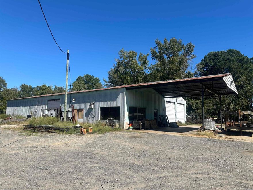 6000SF metal warehouse station. This property to be sold AS IS. This is estate sale with no disclosures. ZONED C2 for businesses. Corner of Hwy 367 (2nd street) and Washington Street.  Lot is approximately 145 x 181.  Survey & leqal on docs on line. Tract 2.
