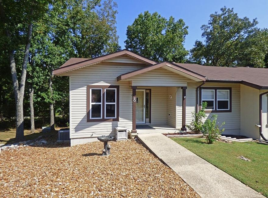 One-Level Townhouse with Three Car Carport - This townhome offers 2 bedrooms, one & a half baths, living room, kitchen with breakfast nook. Central heat pump system, 2 years old. Roof shingles are 3 years old. Three car carport, workshop/storage area under the townhome. This is an end unit that's connected only to one other townhome. Great central location.
