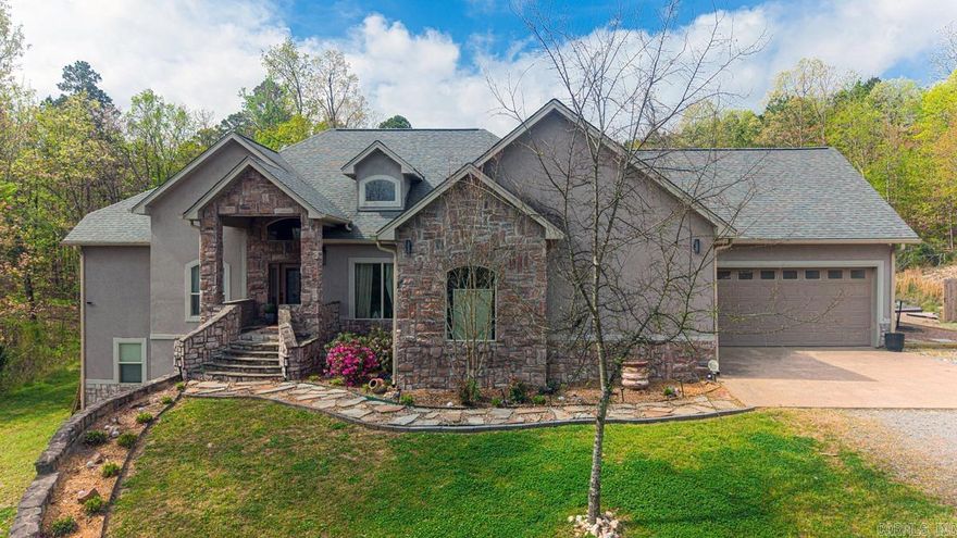 Tucked in the woods, this large home features room for everyone spread across 3 levels. the lower level could be a true second home or in laws quarters with a full second kitchen. Soaring ceilings and a gorgeous updated kitchen. expansive porches across the back where you can enjoy wildlife and privacy. excellent space for a future pool.