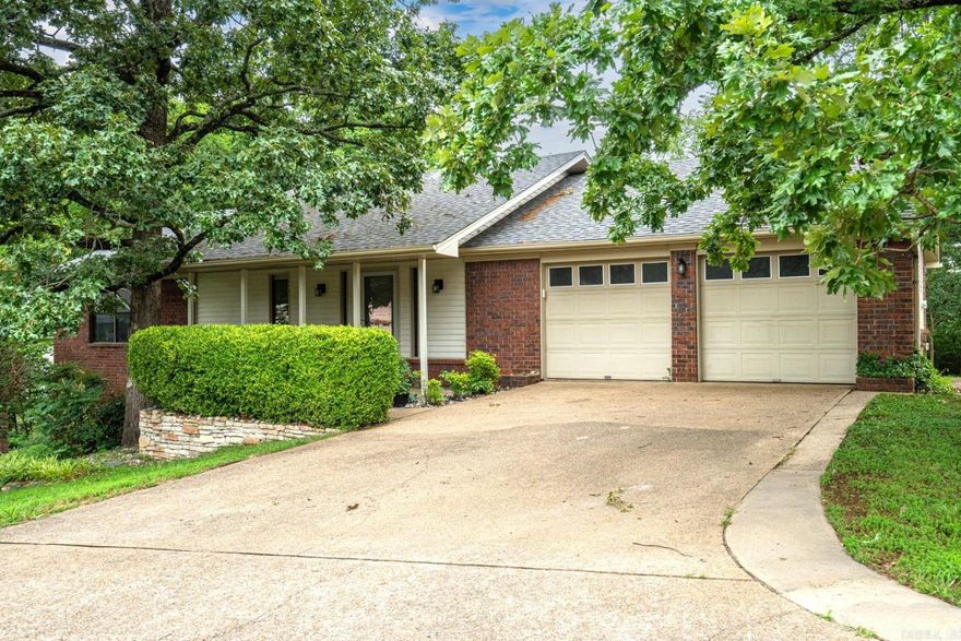 Welcome to this beautifully renovated residence whose premium finishes will surely capture your attention--especially in the home’s high-end kitchen and luxurious bathrooms. Fine finishes include solid bamboo hardwoods, stainless steel appliances, solid marble + exotic granite countertops, custom-tile work (walk-in showers & artist-installed backsplash), and a true spa-like experience with a free-standing tub. If desired, you can easily live primarily on the main level, composed of a luxurious primary suite, large laundry, full guest bath, kitchen, living/dining room, and 2-car garage. A second, main-level bedroom currently serves as an office, which the sellers are willing to convert back into a bedroom upon request. Downstairs offers additional opportunities with an XL bedroom (or flex space), exterior access, and a nice-sized workshop. Outside, enjoy natural views from the covered deck. The deep lot (250’) is utterly enchanting with walking paths and great privacy. Must see to appreciate all this beautiful property has to offer.