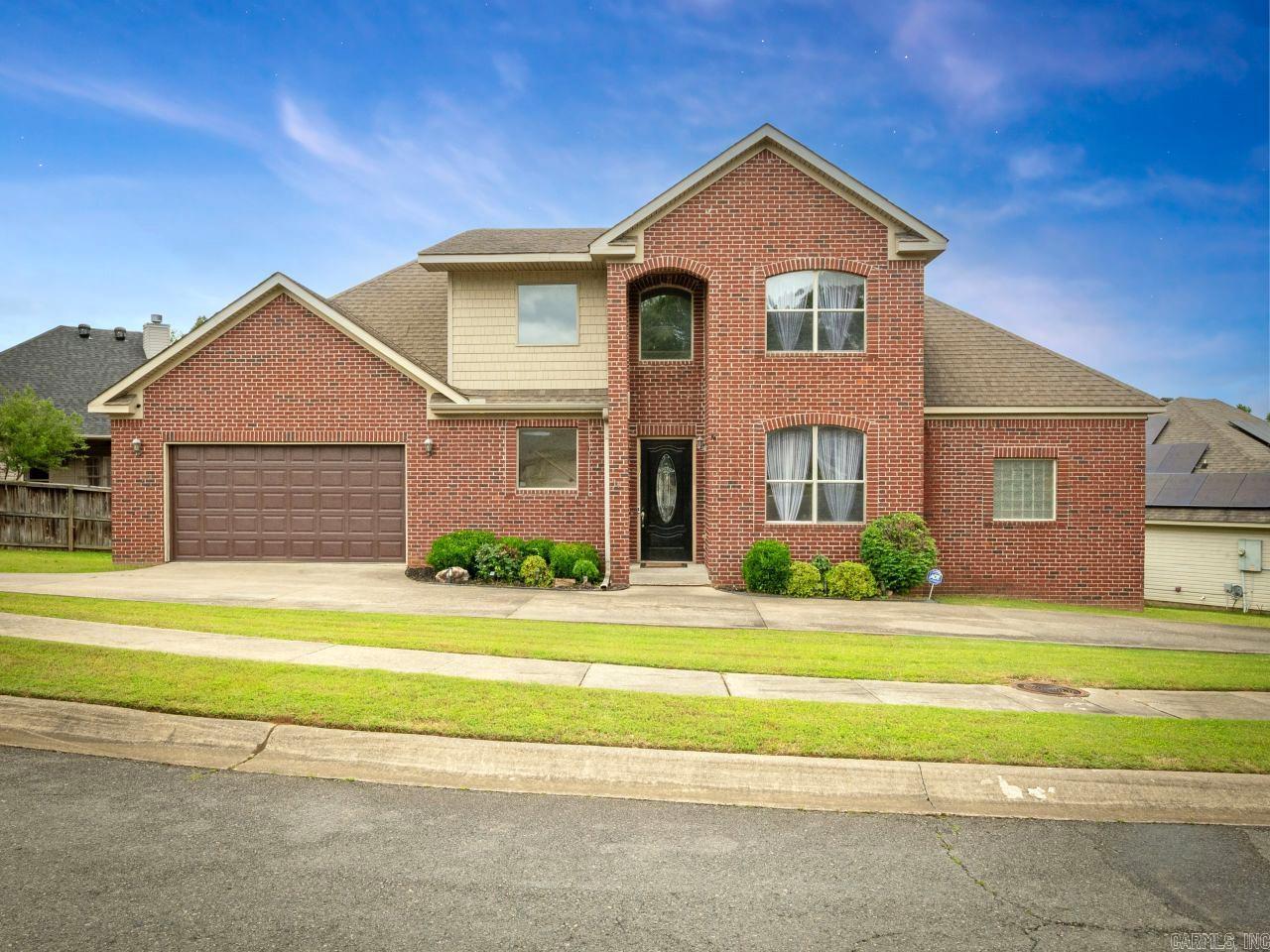 Welcome to this beautifully maintained, custom two-story brick home that perfectly blends curb appeal with modern comfort. Nestled in a serene neighborhood, this home offers a spacious floor plan ideal for both everyday living and entertaining. Step inside and be greeted by a sophisticated flex-space dining area highlighted by an eye-catching chandelier and French doors that add a touch of elegance and privacy. The adjoining open living room features warm hardwood floors, and tall ceilings, creating a welcoming and airy atmosphere. The gourmet kitchen, seamlessly connected to the living space, boasts rich wood cabinetry, granite countertops, and a breakfast bar perfect for the whole family. Upstairs, you'll find generously sized bedrooms, and a luxurious primary suite on the main level. Two-unit AC/furnace replacements 2020 and roof replaced 2021. With its classic architecture, elegant finishes, and prime location, this home offers a perfect blend of style and function. See agent remarks.