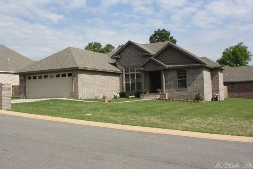 Although it’s 18 months old, you’d think it was a new construction that’s been staged for showing. Wainscoting & extra trims w/ 10’ ceilings & 5” distressed hardwood laminate floors in the formal dining & living rooms. Stained kitchen cabinetry w/ built-in desk area & pantry. Split bedroom floor plan with tray ceiling in the Master suite that features dual sink vanity, walk-in closet, soaker tub plus separate shower. Covered patio in the fenced backyard. Large corner lot w/ big yard outside of fenced area.
